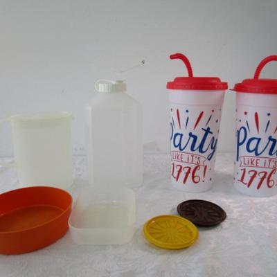 Sale Photo Thumbnail #373: 2- 75 oz. cups with  lids & straws, Tupperware pitcher, Rubbermaid 2 liter container, 1 Tupperware bowl, 1 container with no lid, 2 Tupperware coasters