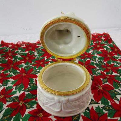 Sale Photo Thumbnail #384: Christmas table runner is 68" long x 15" wide, angel jar is hinged, snow globe is Mickey Mouse & new in box, swan is mounted on a mirror