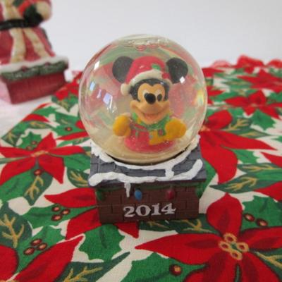 Sale Photo Thumbnail #386: Christmas table runner is 68" long x 15" wide, angel jar is hinged, snow globe is Mickey Mouse & new in box, swan is mounted on a mirror