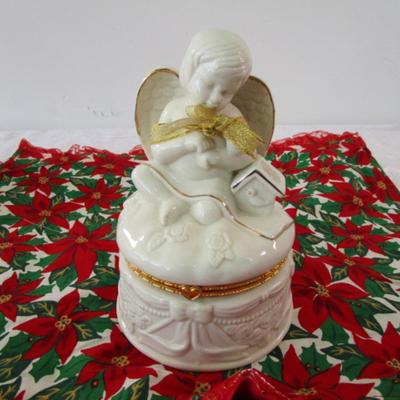 Sale Photo Thumbnail #383: Christmas table runner is 68" long x 15" wide, angel jar is hinged, snow globe is Mickey Mouse & new in box, swan is mounted on a mirror