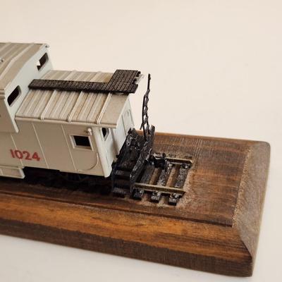 Sale Photo Thumbnail #342: This auction lot is for an L&N Caboose Pen Stand.  This unique desk accessory will look great in the office of any railroad enthusiast.  The pen has some wear and does not write.  The caboose is plastic and it is mounted on a wood base.  See photo for siz