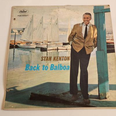 Sale Photo Thumbnail #364: This auction lot is for an Autographed Stan Kenton Vinyl Record.  The record appears to be in good condition but has not been played by us.  The cardboard sleeve has seen some wear and has some splitting to the edges.  Given to our client who was a trombo