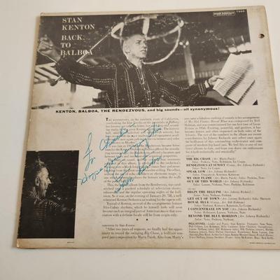 Sale Photo Thumbnail #365: This auction lot is for an Autographed Stan Kenton Vinyl Record.  The record appears to be in good condition but has not been played by us.  The cardboard sleeve has seen some wear and has some splitting to the edges.  Given to our client who was a trombo