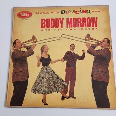Sale Photo Thumbnail #367: This auction lot is for an Autographed Buddy Morrow Vinyl Record.  The record appears to be in good condition but has not been played by us.  The cardboard sleeve has seen some wear and has some aging to it.  Given to our client who was a trombone player 