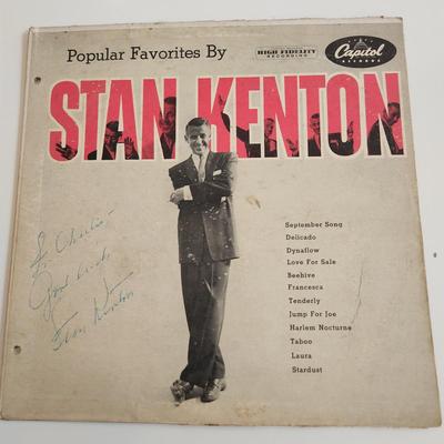 Sale Photo Thumbnail #370: This auction lot is for an Autographed Stan Kenton Vinyl Record.  The record appears to be in good condition but has not been played by us.  The cardboard sleeve has seen some wear and has some edge splitting and aging to it.  Given to our client who was 
