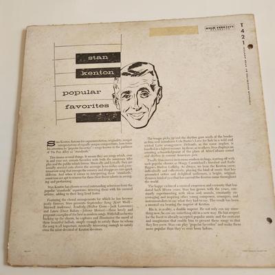 Sale Photo Thumbnail #372: This auction lot is for an Autographed Stan Kenton Vinyl Record.  The record appears to be in good condition but has not been played by us.  The cardboard sleeve has seen some wear and has some edge splitting and aging to it.  Given to our client who was 
