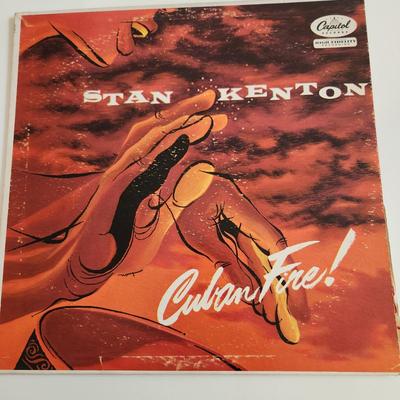 Sale Photo Thumbnail #373: This auction lot is for an Autographed Stan Kenton Vinyl Record.  The record appears to be in good condition but has not been played by us.  The cardboard sleeve has seen some wear and has some edge aging to it.  Given to our client who was a trombone pla