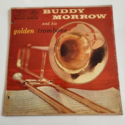 Sale Photo Thumbnail #376: This auction lot is for an Autographed Buddy Morrow Vinyl Record.  The record appears to be in good condition but has not been played by us.  The cardboard sleeve has seen some wear and has some edge splitting and aging to it.  Given to our client who was