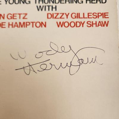 Sale Photo Thumbnail #383: This auction lot is for an Autographed Woody Herman Vinyl Record.  The record appears to be in good condition but has not been played by us.  The cardboard sleeve has seen some wear and has some edge splitting and aging to it.  Given to our client who was