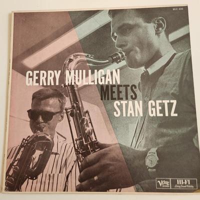 Sale Photo Thumbnail #389: This auction lot is for a Vintage Stan Getz Vinyl Music Album. This is The Gerry Mulligan Meets Stan Getz on the Verve Label.  The record has not been played by us but appears to be in good condition.  The sleeve has some wear and aging with possible edge