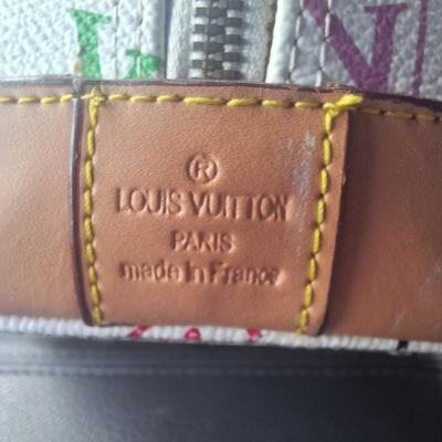 Sale Photo Thumbnail #841: Beautiful Louis Vuitton handbag.  Please see all photos.  We believe it to be authentic.   It is a little stiff.  The zipper works well.  We do not have the long shoulder strap or the  dust bag