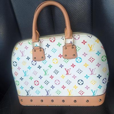 Sale Photo Thumbnail #834: Beautiful Louis Vuitton handbag.  Please see all photos.  We believe it to be authentic.   It is a little stiff.  The zipper works well.  We do not have the long shoulder strap or the  dust bag