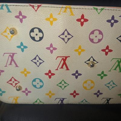 Sale Photo Thumbnail #836: Beautiful Louis Vuitton handbag.  Please see all photos.  We believe it to be authentic.   It is a little stiff.  The zipper works well.  We do not have the long shoulder strap or the  dust bag