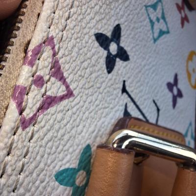Sale Photo Thumbnail #839: Beautiful Louis Vuitton handbag.  Please see all photos.  We believe it to be authentic.   It is a little stiff.  The zipper works well.  We do not have the long shoulder strap or the  dust bag