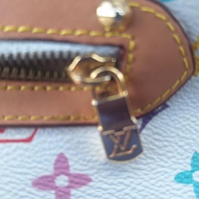 Sale Photo Thumbnail #842: Beautiful Louis Vuitton handbag.  Please see all photos.  We believe it to be authentic.   It is a little stiff.  The zipper works well.  We do not have the long shoulder strap or the  dust bag