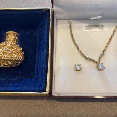 Cubic zirconia necklace, and earrings with Avon brooch
