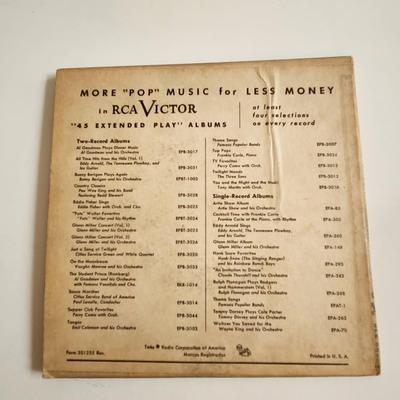 Sale Photo Thumbnail #439: This auction lot is for a Vintage 45RPM War of the Bands Concert Record.  This recording on two extended play 45 RPM records are a dueling offering from the likes of the Combined Orchestras of Ralph Flanagan and Buddy Morrow.