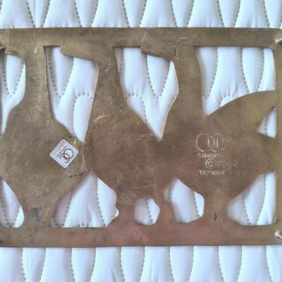 Vintage brass ducks plague