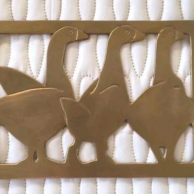 Vintage brass ducks plague