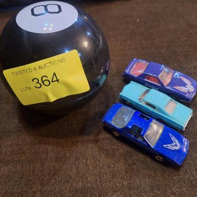 Magic eight ball and vintage toy cars