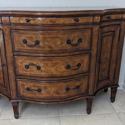 Theodore Alexander Curved Front Sideboard with burled maple wood.  Hardware is an oiled brass 