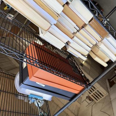 Sale Photo Thumbnail #72: This is for 1 shelf of books. Misc. 
Box’s are not included. They are in a different lot.