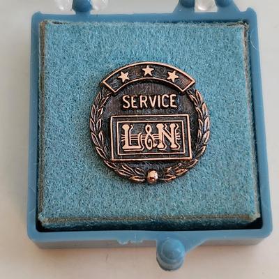 Sale Photo Thumbnail #493: This auction lot is for a L&N Railroad Service Pin.  This pin has no markings.  Nice find for the collector.