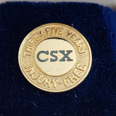 Sale Photo Thumbnail #496: This auction lot is for a CSX Railroad 35 Year Gold Service Pin. The pin is marked 1/10 10K on the verso.  Great for the railroad collector.