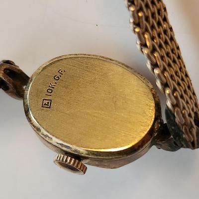 Sale Photo Thumbnail #521: This auction lot is for a Ladies Rado Gold Watch.  The watch is marked 10KGF.  The very pretty watch band to which it is attached is marked Speidel and also marked 10KGF.  Rado watches are Swiss made - the watch is not running at this time. This watch is 