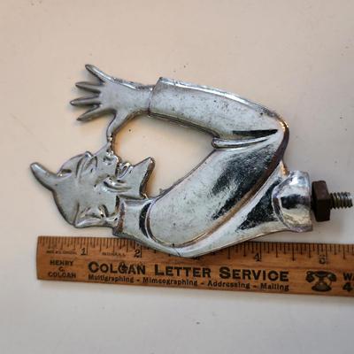 Sale Photo Thumbnail #56: This auction lot is for a Devil Hood Ornament.  The devil you say - as he razzes you back. This nifty find would look perfect mounted on so many things - from you car or bike to who know what.  Chrome plated metal with screw base.  See photo for size.  Wh
