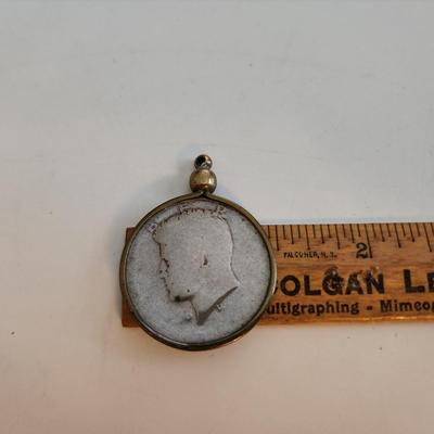 Sale Photo Thumbnail #528: This auction lot is for a Well-Worn Kennedy Half Dollar Watch Fob.  The encasement ring "might" be gold but it is not marked.  Used by an L&N Railroad Train Conductor for many years.