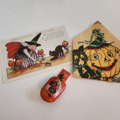 Sale Photo Thumbnail #64: This auction lot is for Vintage Halloween Items.  The clicker is the premo item in this grouping.  It still works and has some very fun graphics.  The napkin fell out of a scrap book but has some age.  The post card is a recent reproduction of an old post