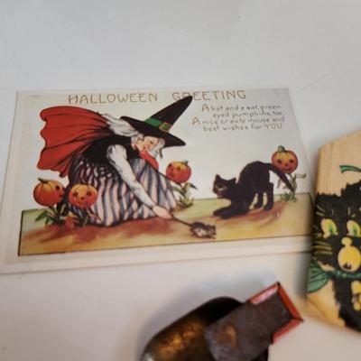 Sale Photo Thumbnail #68: This auction lot is for Vintage Halloween Items.  The clicker is the premo item in this grouping.  It still works and has some very fun graphics.  The napkin fell out of a scrap book but has some age.  The post card is a recent reproduction of an old post
