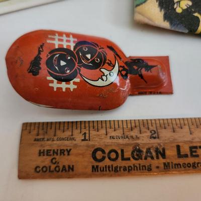 Sale Photo Thumbnail #69: This auction lot is for Vintage Halloween Items.  The clicker is the premo item in this grouping.  It still works and has some very fun graphics.  The napkin fell out of a scrap book but has some age.  The post card is a recent reproduction of an old post
