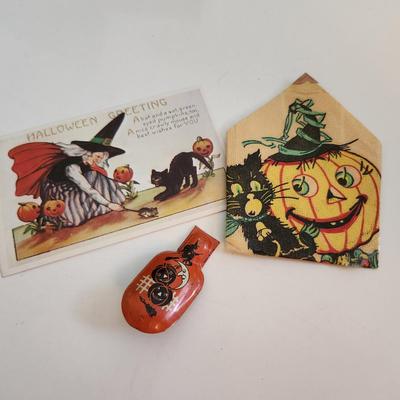 Sale Photo Thumbnail #65: This auction lot is for Vintage Halloween Items.  The clicker is the premo item in this grouping.  It still works and has some very fun graphics.  The napkin fell out of a scrap book but has some age.  The post card is a recent reproduction of an old post