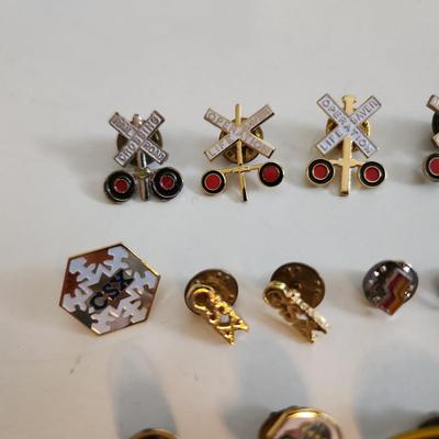 Sale Photo Thumbnail #551: This auction lot is for a Collection of Railroad Pins.  This gathering of 16 various pins speak to a long love of them.  The 2716 pin refers to an antique locomotive.  Great grouping for the collector or the reseller.