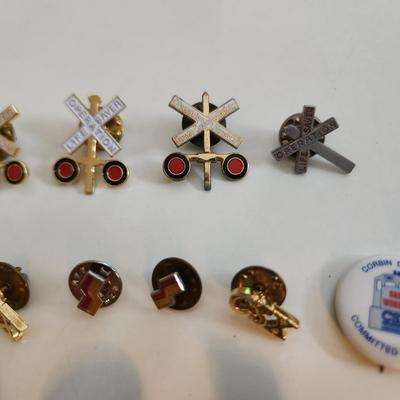 Sale Photo Thumbnail #550: This auction lot is for a Collection of Railroad Pins.  This gathering of 16 various pins speak to a long love of them.  The 2716 pin refers to an antique locomotive.  Great grouping for the collector or the reseller.