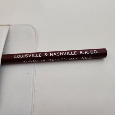 Sale Photo Thumbnail #563: This auction lot is for a L&N Railroad Pocket Protector & Pencil.  Nice small items for the railroad and/or L&N collector.