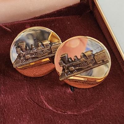 Sale Photo Thumbnail #571: This auction lot is for a set of Vintage Locomotive Cuff Links.  They have a nice design and good coloration.  No markings.