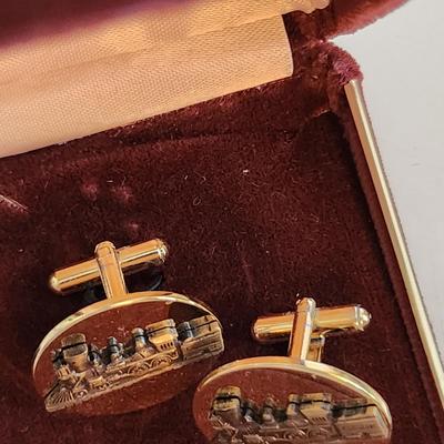 Sale Photo Thumbnail #572: This auction lot is for a set of Vintage Locomotive Cuff Links.  They have a nice design and good coloration.  No markings.