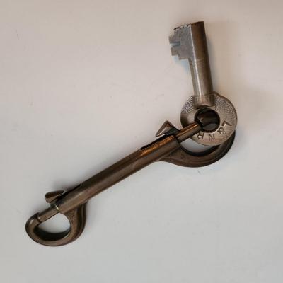 Sale Photo Thumbnail #54: This auction lot is for a L&N Railroad Master Key.  This master key is marked and is hanging on a heavy metal clip holder - the key is easily removed.
