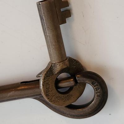 Sale Photo Thumbnail #52: This auction lot is for a L&N Railroad Master Key.  This master key is marked and is hanging on a heavy metal clip holder - the key is easily removed.