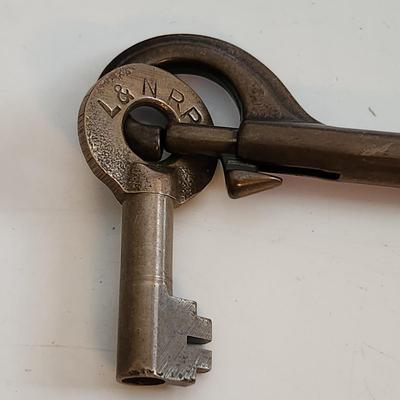 Sale Photo Thumbnail #51: This auction lot is for a L&N Railroad Master Key.  This master key is marked and is hanging on a heavy metal clip holder - the key is easily removed.