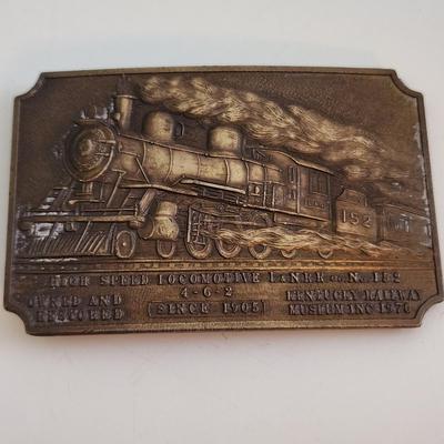 Sale Photo Thumbnail #582: This auction lot is for a L&N Locomotive #152 Belt Buckle. This heavy-duty buckle is quite the memento of a bygone era.  This locomotive was one of the last great steam engines.  You can see the real thing at the museum in New Haven, KY.