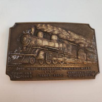 Sale Photo Thumbnail #581: This auction lot is for a L&N Locomotive #152 Belt Buckle. This heavy-duty buckle is quite the memento of a bygone era.  This locomotive was one of the last great steam engines.  You can see the real thing at the museum in New Haven, KY.
