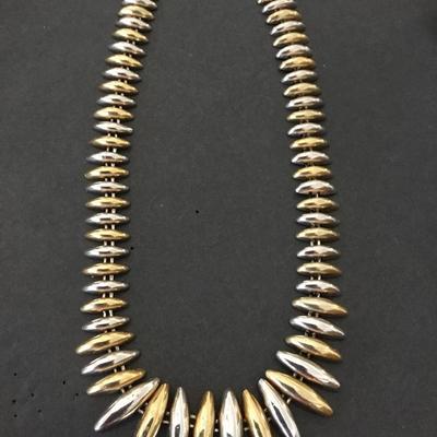 Beautiful vintage, gold and silver toned mid-century necklace. Very nice.