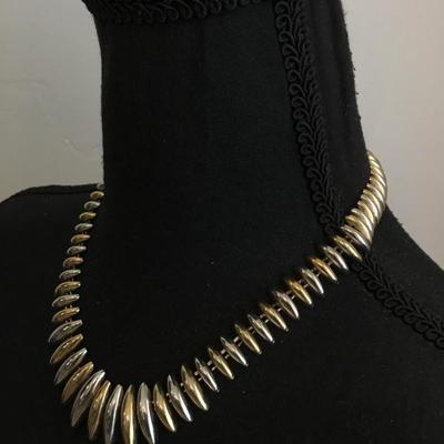 Beautiful vintage, gold and silver toned mid-century necklace. Very nice.