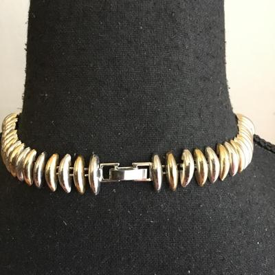 Beautiful vintage, gold and silver toned mid-century necklace. Very nice.