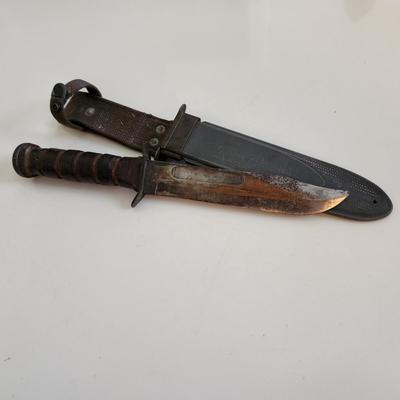 Sale Photo Thumbnail #11: This auction lot is if a WW2 US Navy Combat Knife & Sheath.  This nifty military collectible is marked as former property of the USN.  Nice item for the military or knife collector.