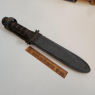 Sale Photo Thumbnail #8: This auction lot is if a WW2 US Navy Combat Knife & Sheath.  This nifty military collectible is marked as former property of the USN.  Nice item for the military or knife collector.